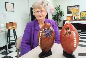 For the Walk of Creativity, Peggy Robinson, a member of Madison Senior Center, entered ceramic footballs for the auburn Tigers and Alabama Crimson Tide. RECORD PHOTO/GREGG L. PARKER