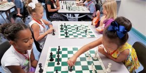 Students in grades K-2 are learning to play chess in a program that Dorinda White, principal of Rainbow Elementary School, has started. In this photo, first-grade girls are learning to play the game. CONTRIBUTED
