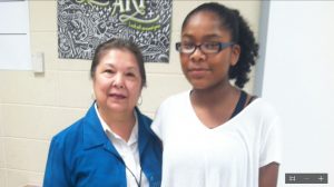 Discovery art teacher Raquel Spiegel, at left, congratulates Aaliyah Coe for her first-place painting in the Hispanic Heritage Art Contest on Redstone Arsenal. CONTRIBUTED