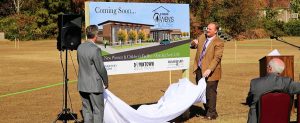 Downtown Rescue Mission Board (DRM) Chairman Trey Bentley, at left and DRM President/CEO Keith Overholt unveil the rendering of Owen's House at the groundbreaking. CONTRIBUTED