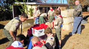Members of Boy Scout Troop 201 of Madison prepare to help American Legion members place Christmas wreaths on veterans' gravesites. CONTRIBUTED