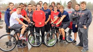 Members of the Bob Jones Varsity Baseball Team inspect the bicycles that they gave to Kids to Love. CONTRIBUTED