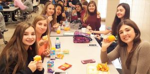 During lunchtime, Madison students enjoy farm-fresh oranges from Satsuma, Ala. CONTRIBUTED