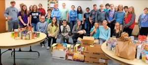 Youth with The Church of Jesus Christ of Latter-day Saints collected hundreds of food items for distribution in Madison and Athens. CONTRIBUTED