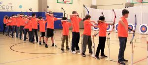 Liberty Middle School's Archery Team stands on the shooting line at the Maverick Shoot-Out at Mill Creek Elementary School. CONTRIBUTED