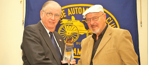 Bob Parrish, president of Antique Automobile Club of America, from left, presents the I. C. Kirkham National Award to Peter Catanese, North Alabama Region board member, at the Antique Automobile Club of America’s national meeting in Philadelphia, Pa. CONTRIBUTED 
